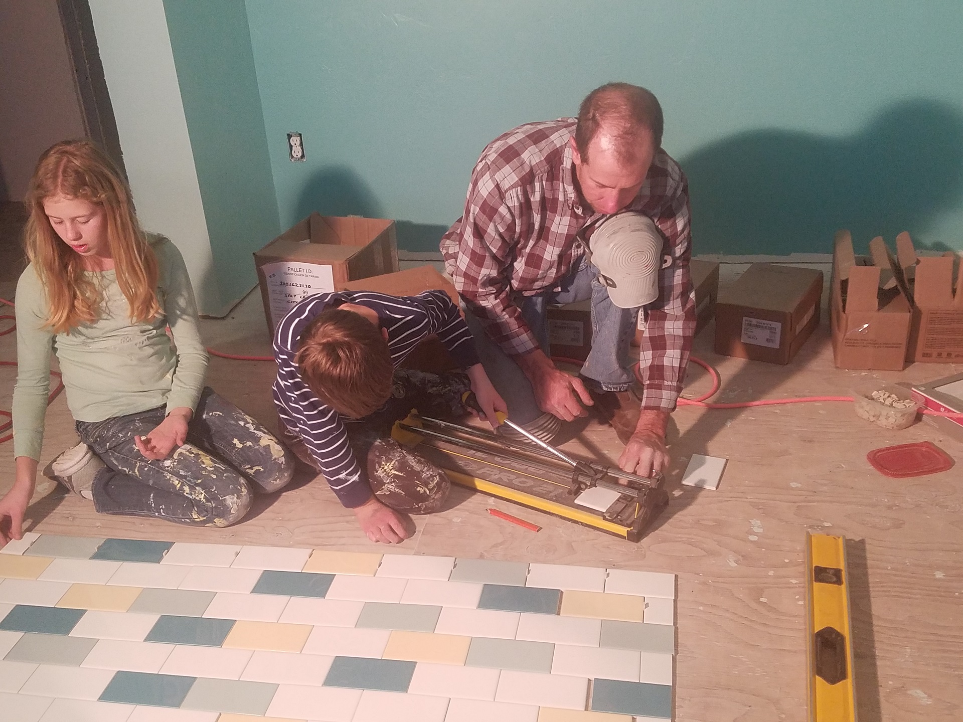 Family Laying Tiles